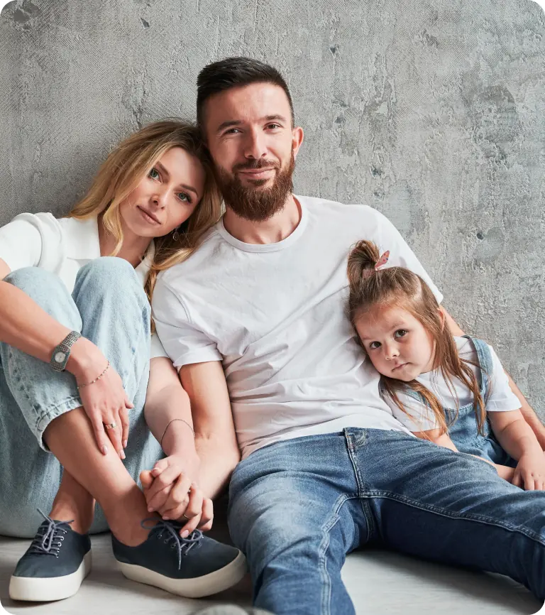 Family Sitting Together Smiling